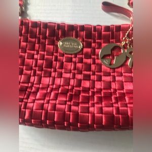 This red cranberry Ready for the holiday, Sac purse Brand new with tags on.